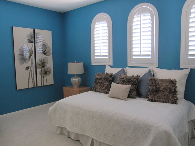 Plantation shutters in a bedroom